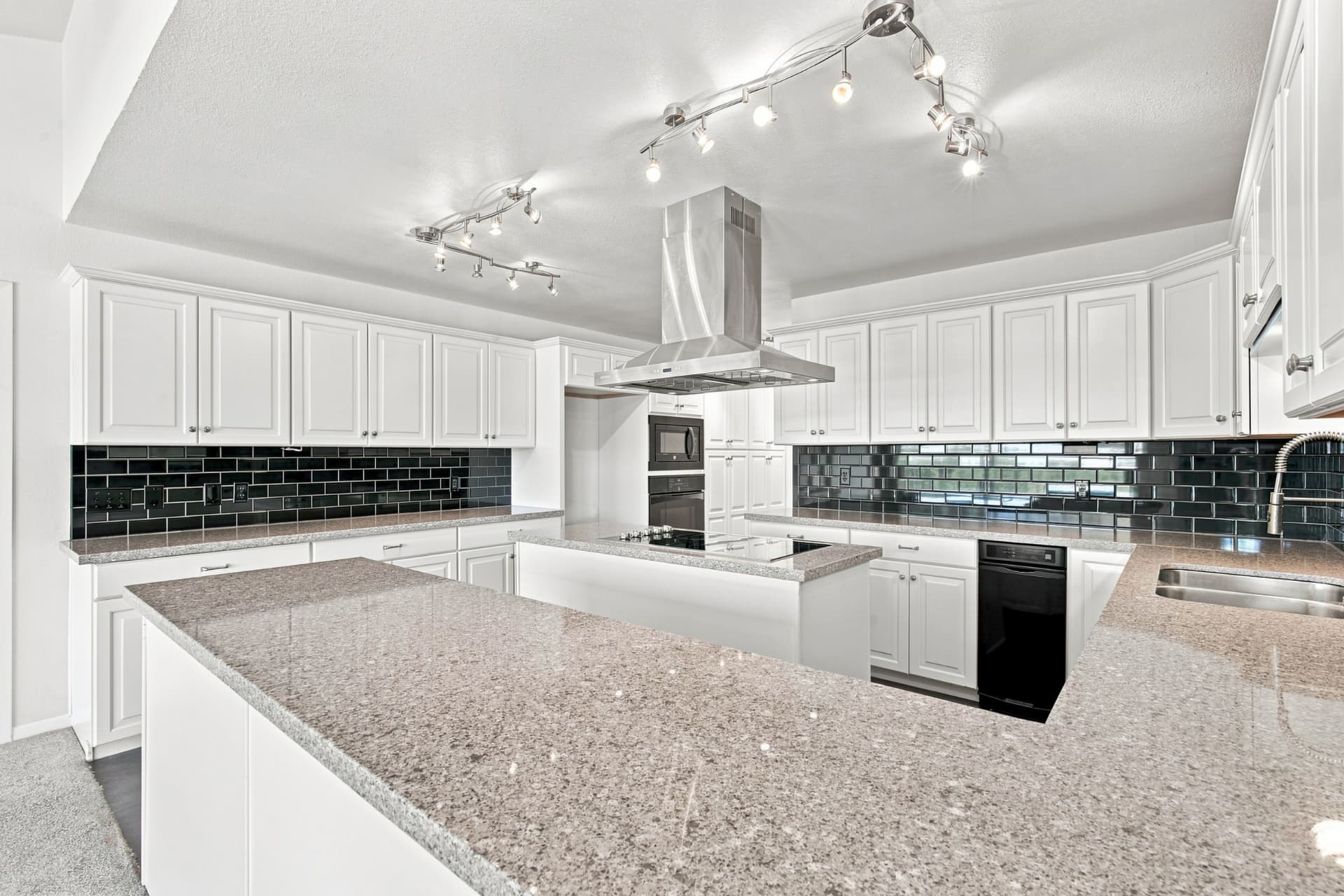 Kitchen detail with cabinetry and range hood