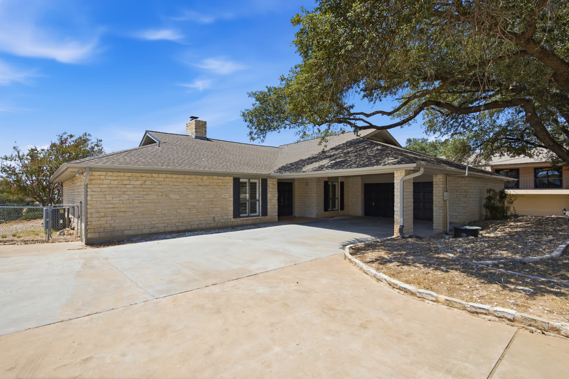 Front elevation of the single-level limestone home