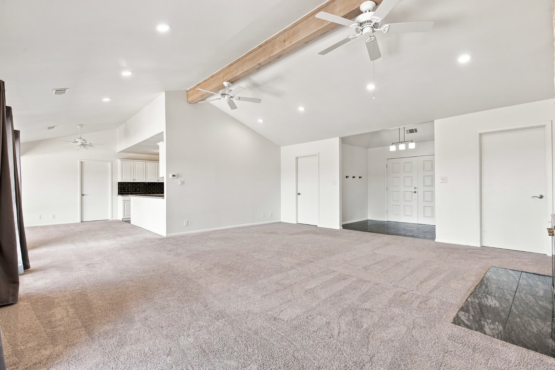 Living area looking toward the entry and kitchen