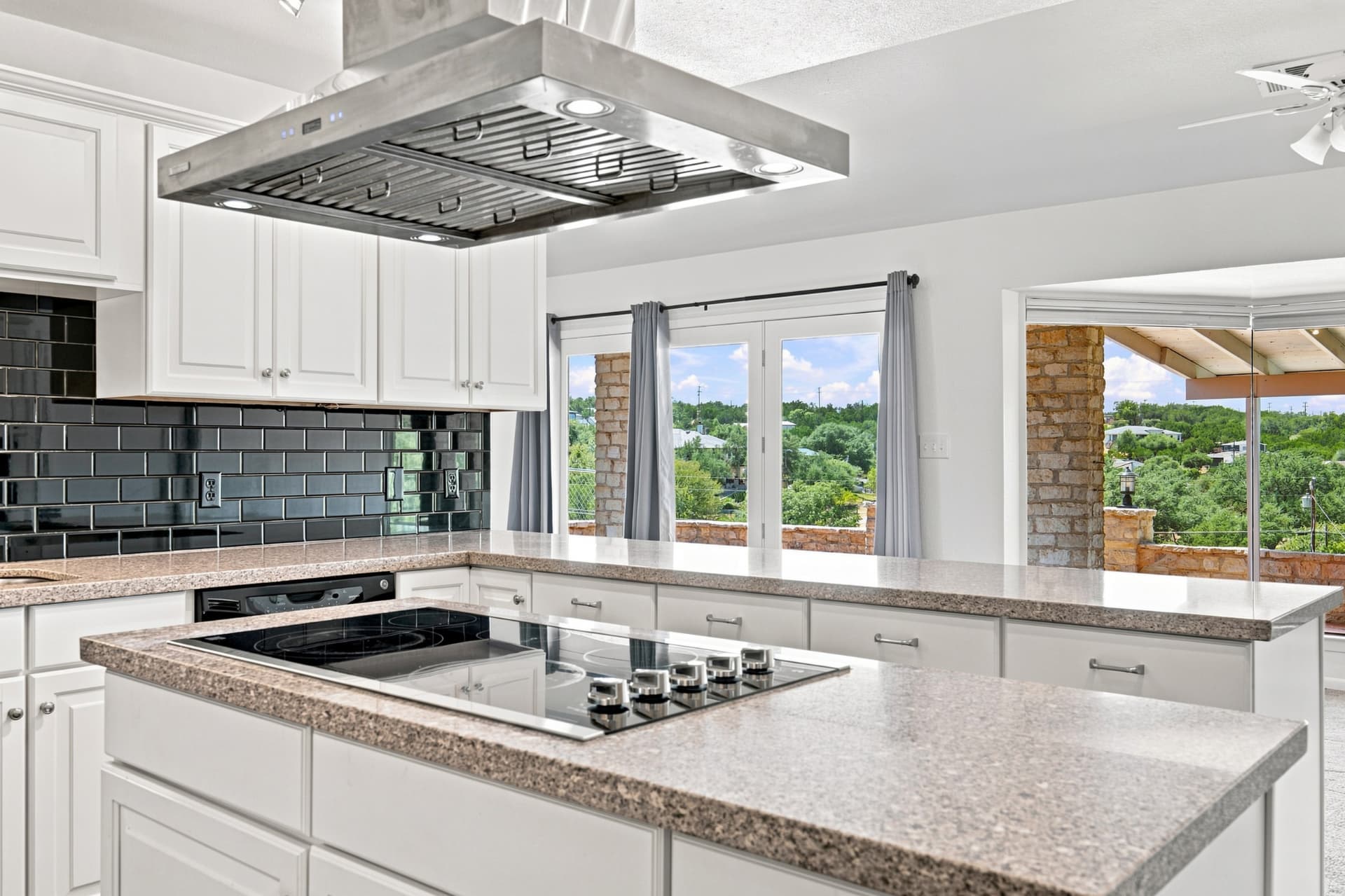 Kitchen counters with French doors to the terrace beyond