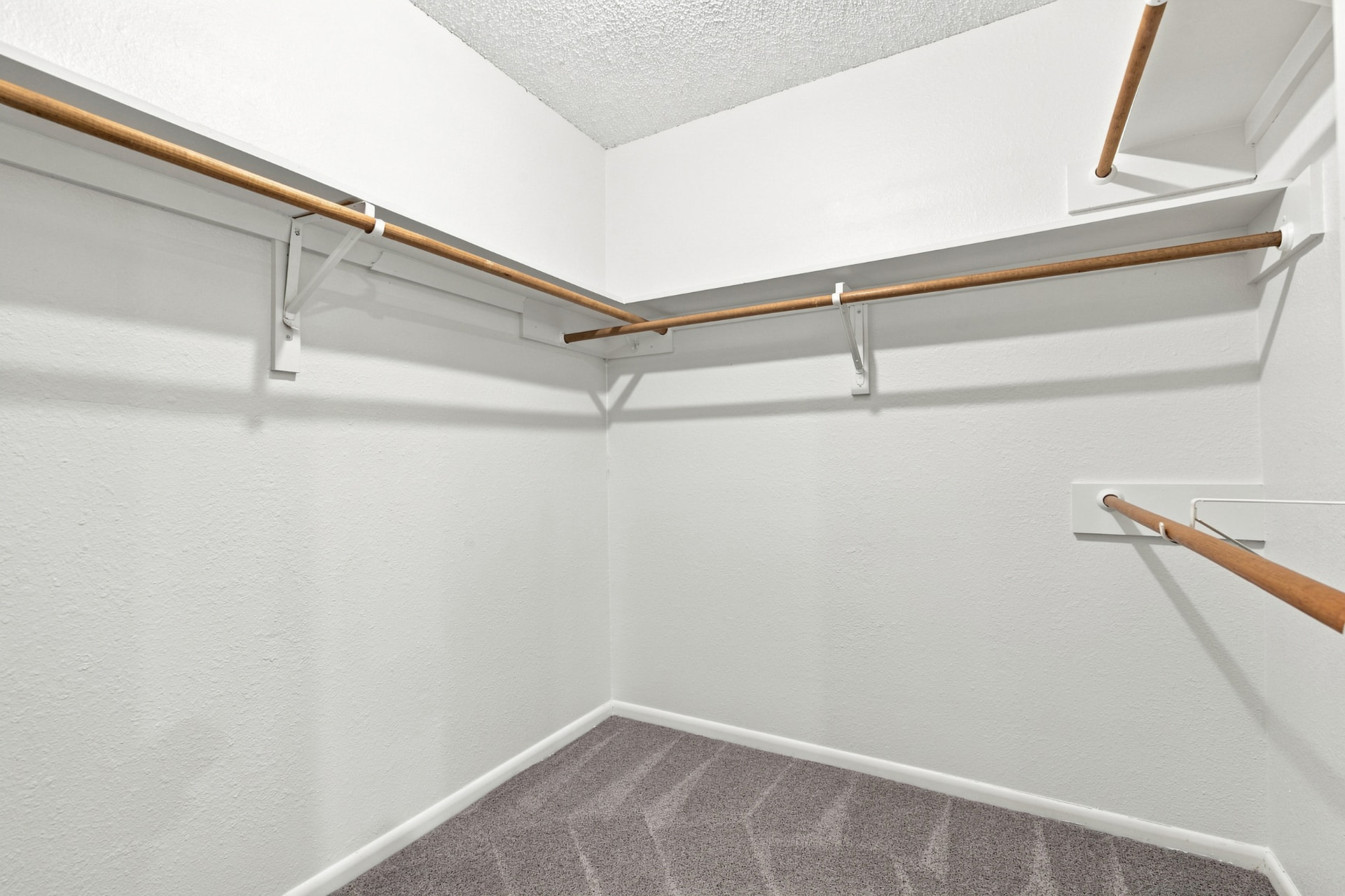 Second walk-in closet with double hanging rods
